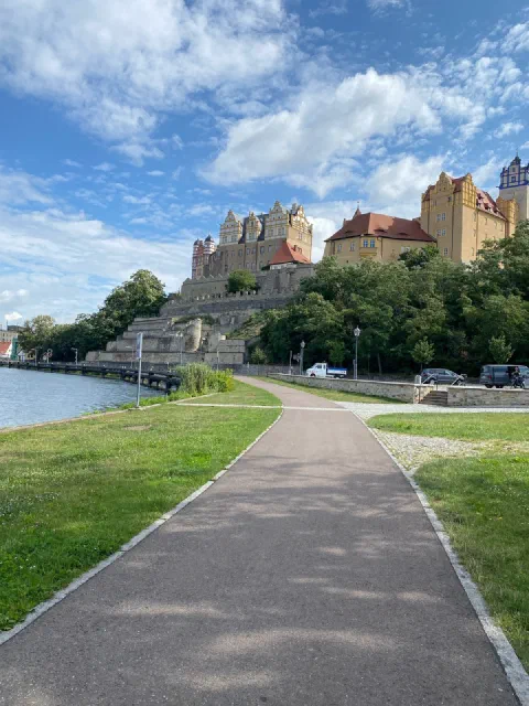 Bernburg castle above the river and its promenade