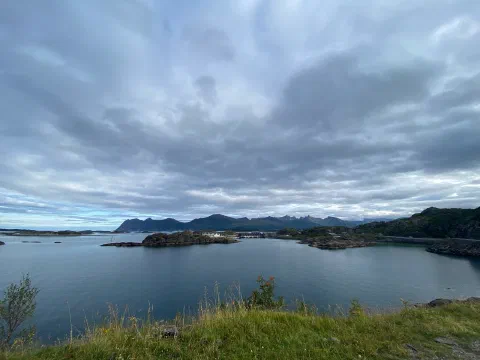Archipelago seen from a grassy hilltop under moody clouds